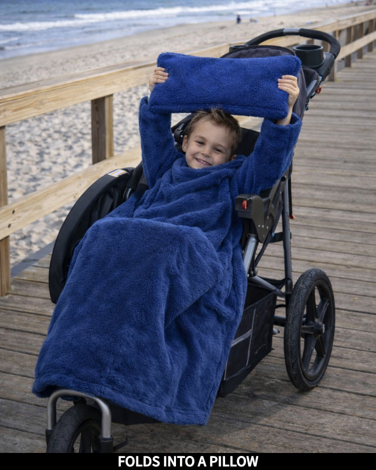 Product Images of Stroller Slanket folded into a pillow being held up by the child