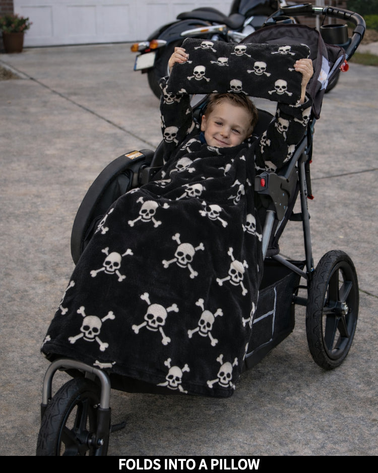 Product Images of Stroller Slanket folded into a pillow being held up by the child