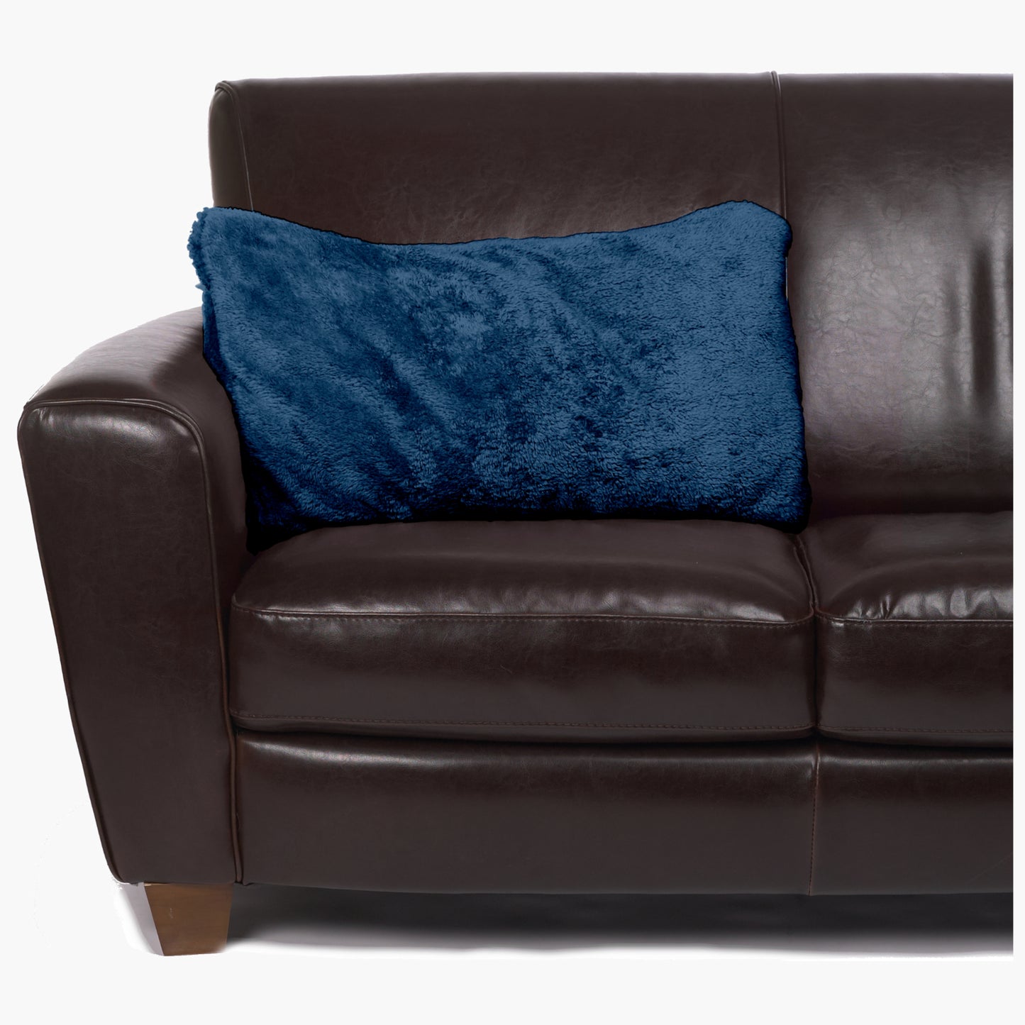 Slanket - The Original Blanket with Sleeves folds into a couch cushion which is laying on a couch