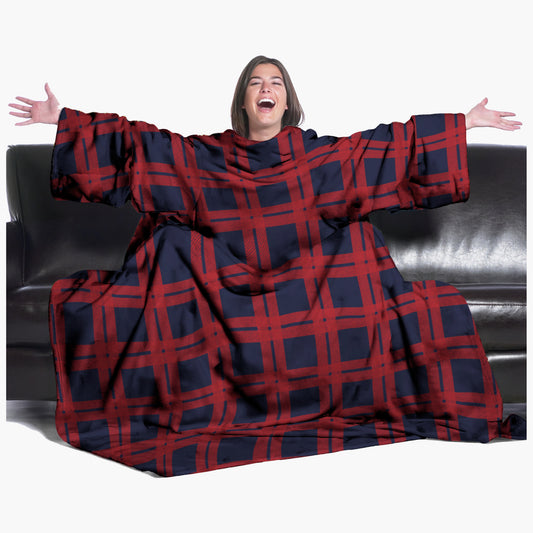 The Ultimate Slanket - The Original Blanket with Sleeves. Women using it on a couch with arms spread out with big smile