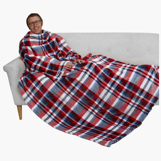 The Ultimate Slanket - The Original Blanket with Sleeves. Man using it on a couch.