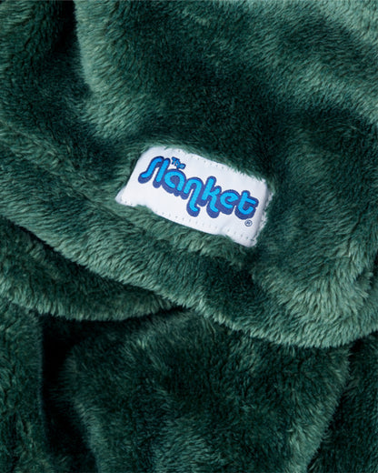 Close-up of hunter green fleece with the blue Slanket logo tag
