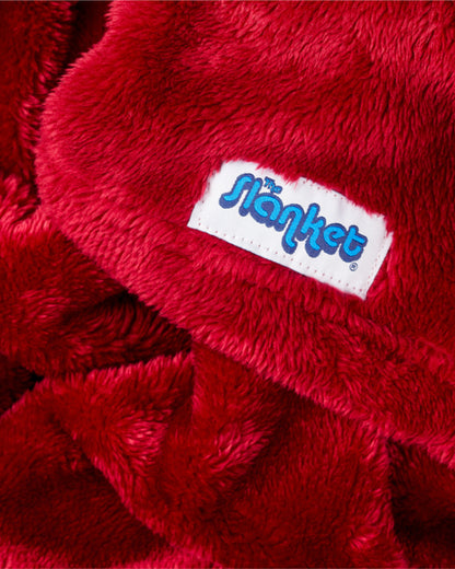 Close-up of deep ruby red fleece with the blue Slanket logo tag