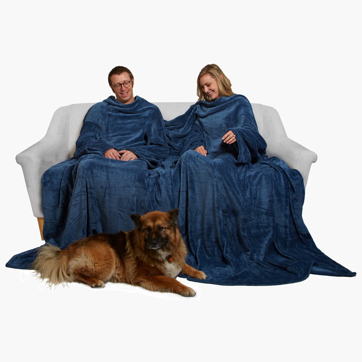 Slanket Siamese - The Original Blanket with Sleeves shown being used by a couple on a couch
