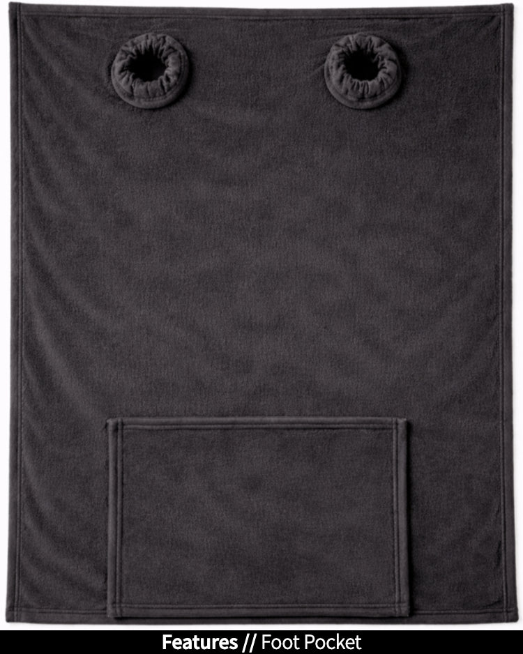 Black Slanket laid flat, back view, showing the sleeve openings and built-in foot pocket