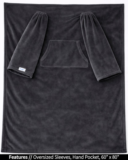 Black Slanket laid flat, front view, with callouts for oversized sleeves and hand pocket, 60 x 80 in