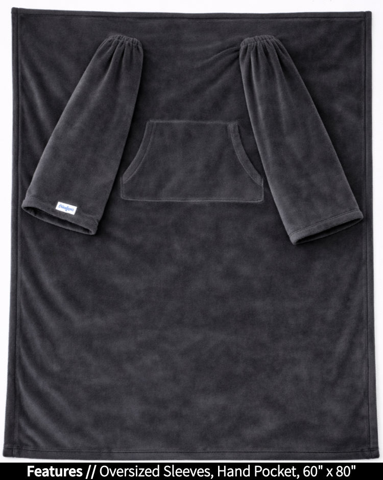 Black Slanket laid flat, front view, with callouts for oversized sleeves and hand pocket, 60 x 80 in
