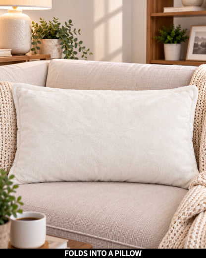 Cloud Dancer Slanket folded into a pillow, shown as a decorative cushion, captioned Folds Into a Pillow