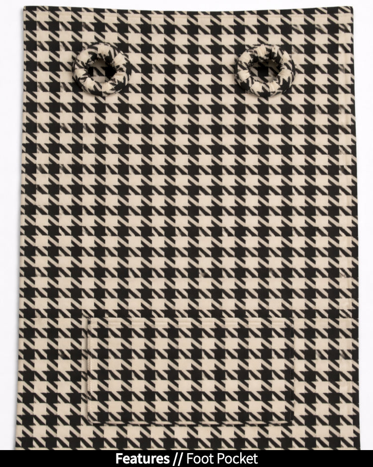Houndstooth Slanket laid flat, back view, showing the sleeve openings and built-in foot pocket
