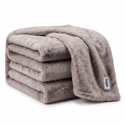 Slanket Rogue plush throw in Shadow gray folded in a stack with the blue logo label showing