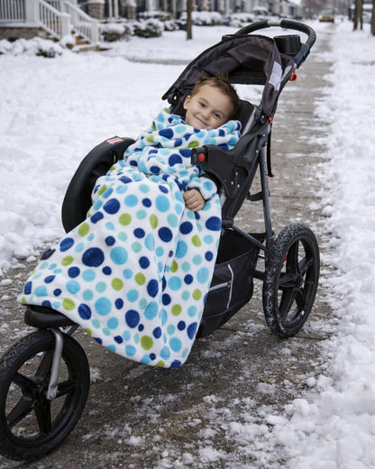 Product image of a little boy using Stroller Slanket while sitting in her stoller