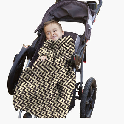 The Stroller Slanket - The Original Blanket with Sleeves. Kid in a stroller wrapped up in the luxurious material to stay warm on chilly evening or morning walks