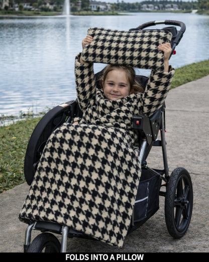 Product Images of Stroller Slanket folded into a pillow being held up by the child