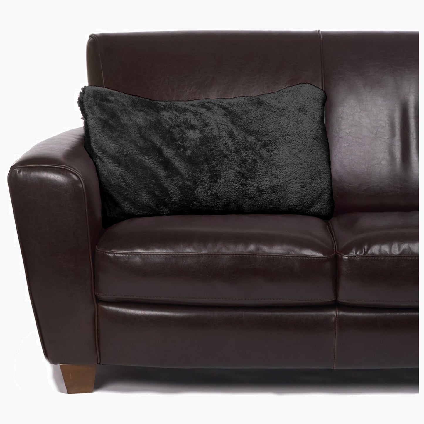 Slanket - The Original Blanket with Sleeves folds into a couch cushion which is laying on a couch