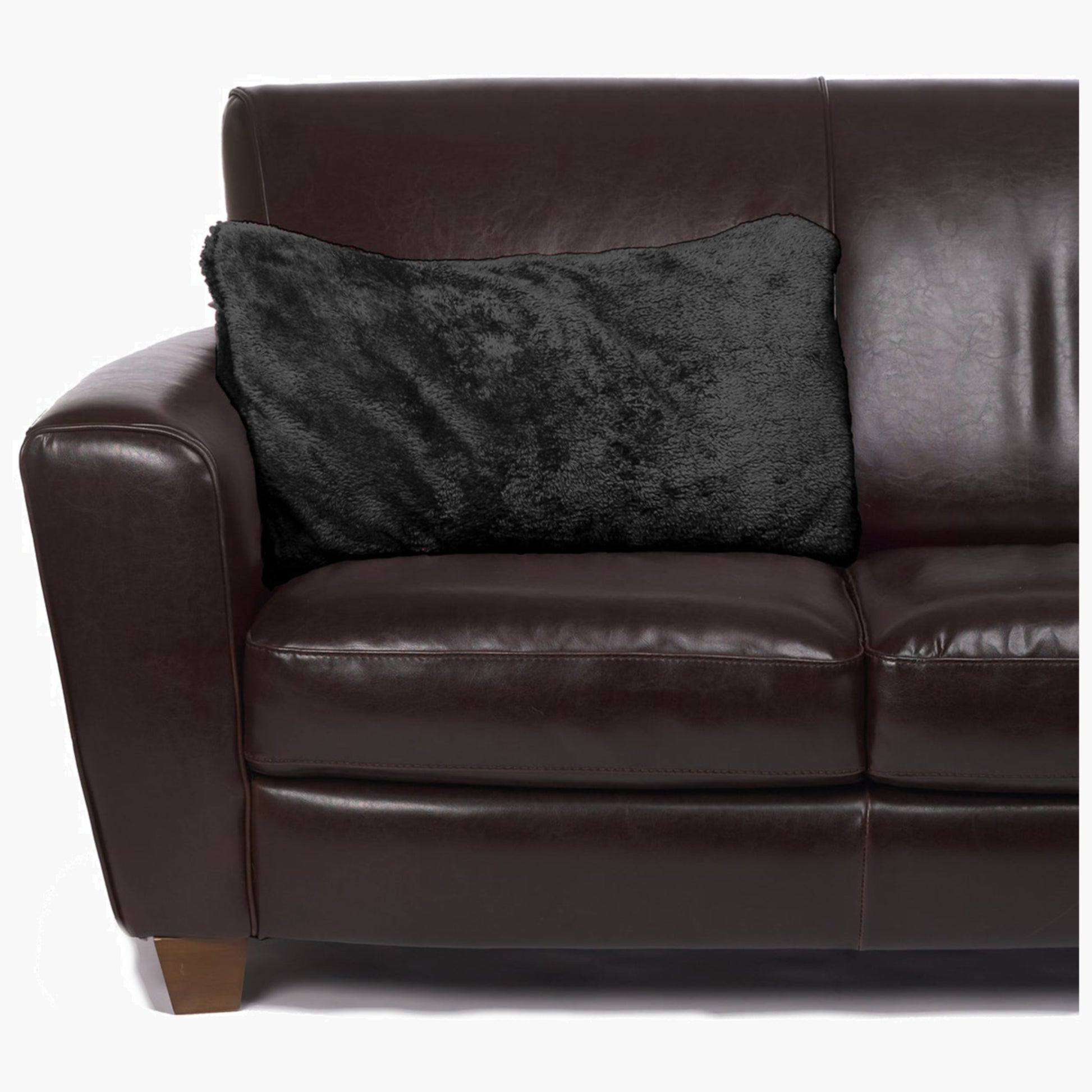 Slanket - The Original Blanket with Sleeves folds into a couch cushion which is laying on a couch