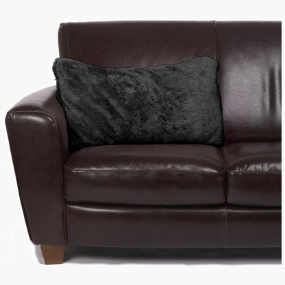 Slanket - The Original Blanket with Sleeves folds into a couch cushion which is laying on a couch