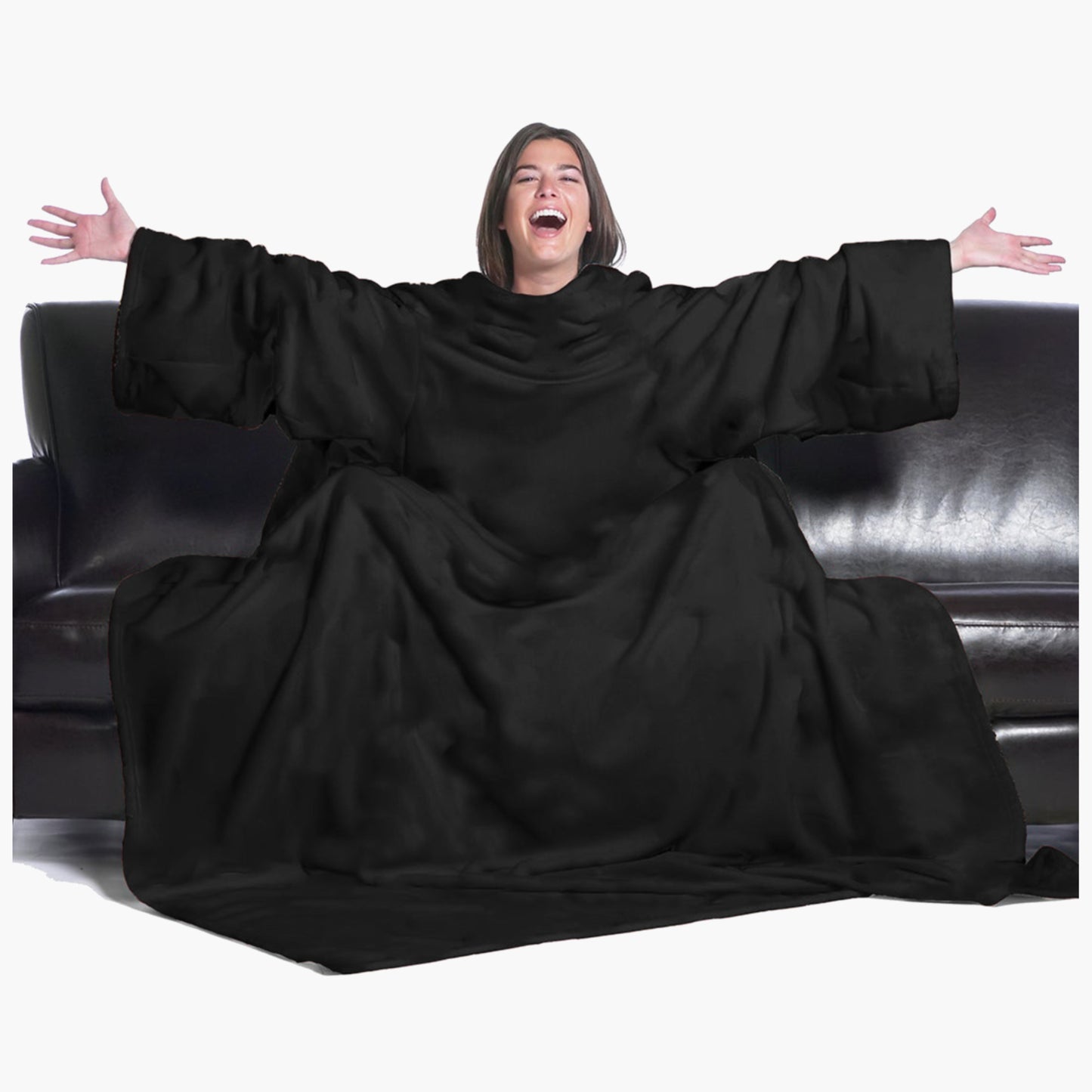 The Ultimate Slanket - The Original Blanket with Sleeves. Women using it on a couch with arms spread out with big smile 