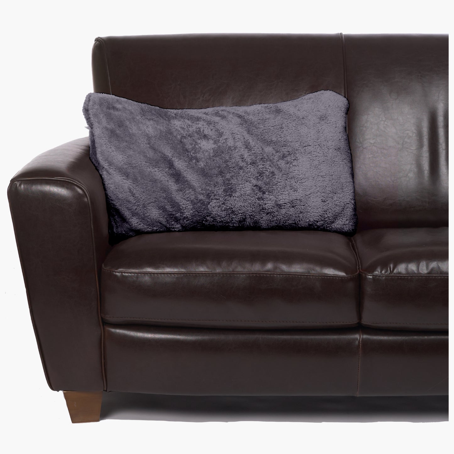 Slanket - The Original Blanket with Sleeves folds into a couch cushion which is laying on a couch