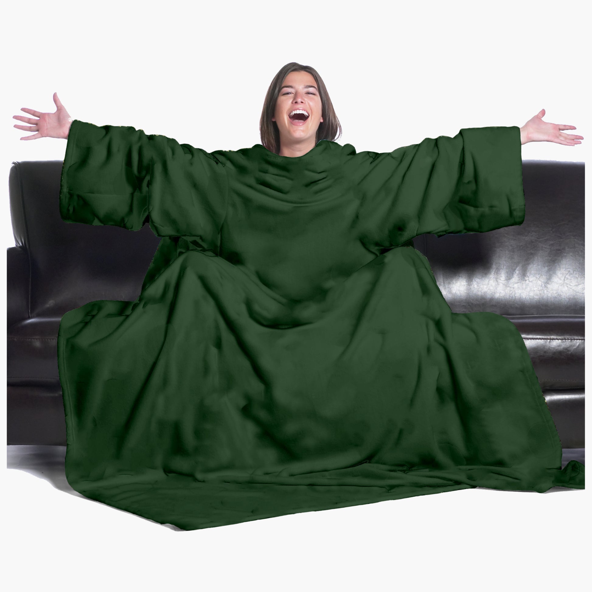 The Ultimate Slanket - The Original Blanket with Sleeves. Women using it on a couch with arms spread out with big smile 