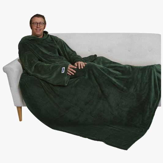 The Ultimate Slanket - The Original Blanket with Sleeves. Man using it on a couch.