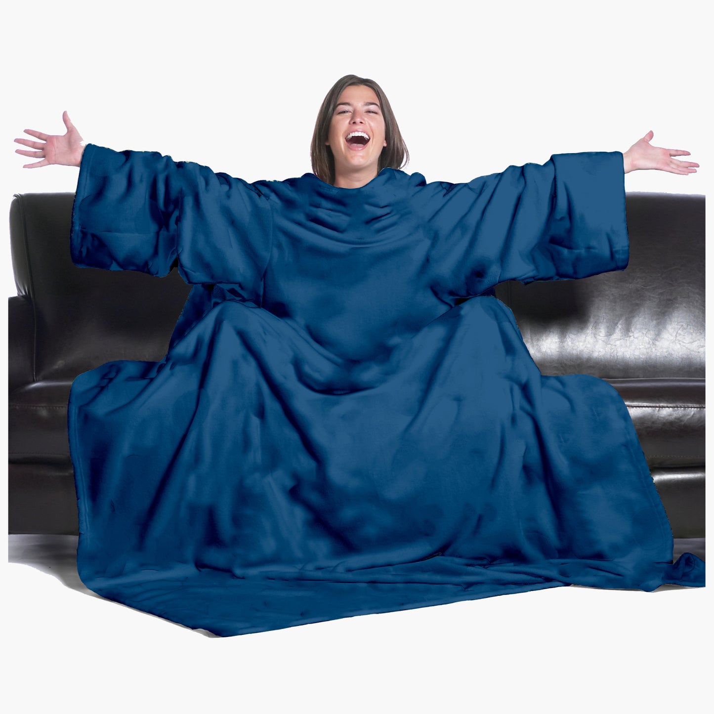 The Ultimate Slanket - The Original Blanket with Sleeves. Women using it on a couch with arms spread out with big smile 