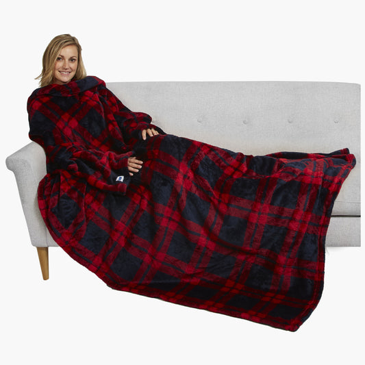 The Ultimate Slanket - The Original Blanket with Sleeves. Women using it on a couch.