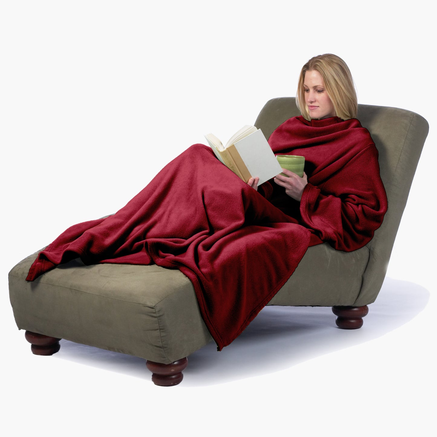 The Ultimate Slanket - The Original Blanket with Sleeves. Women using it while sitting in chaise lounge reading a book and drinking tea
