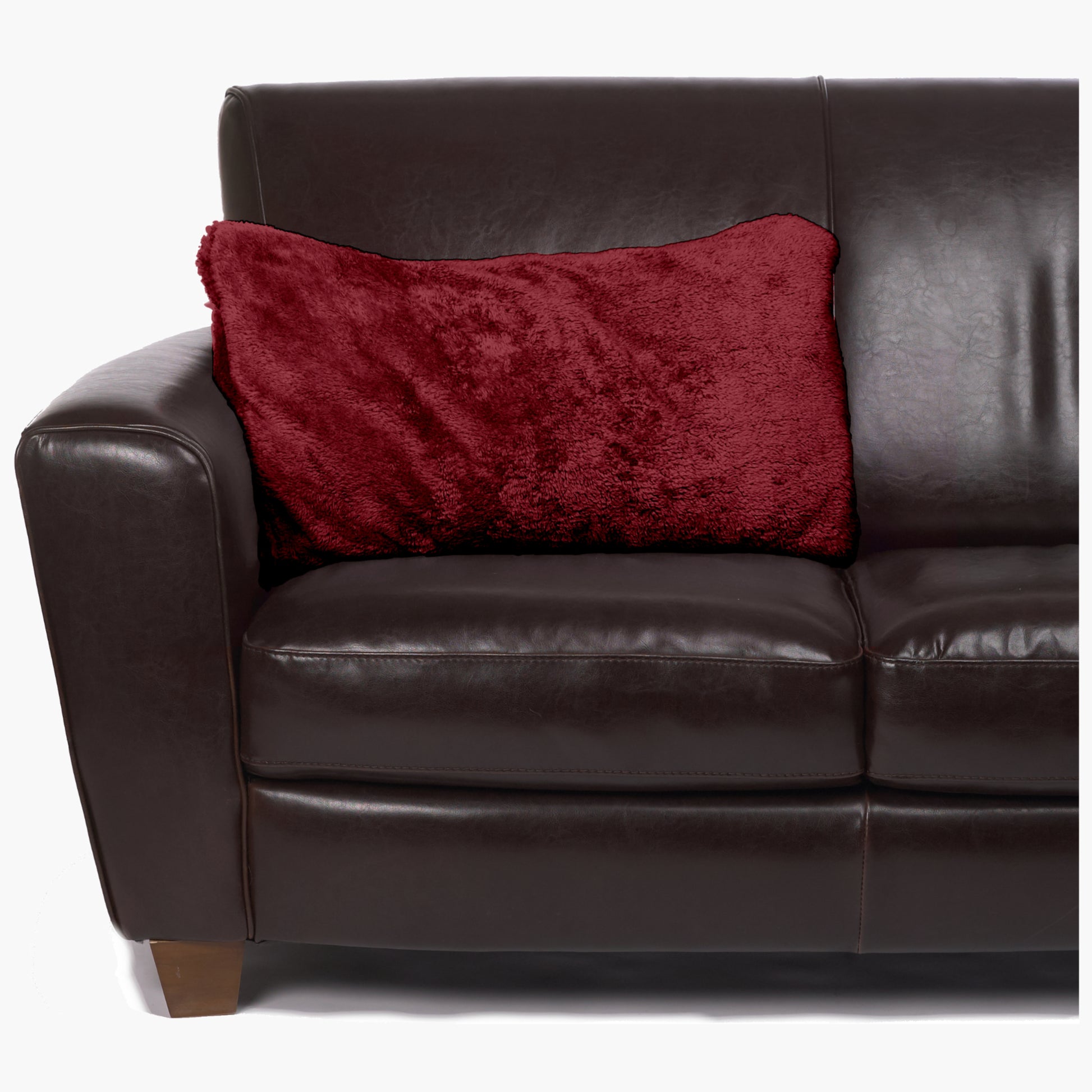 Slanket - The Original Blanket with Sleeves folds into a couch cushion which is laying on a couch