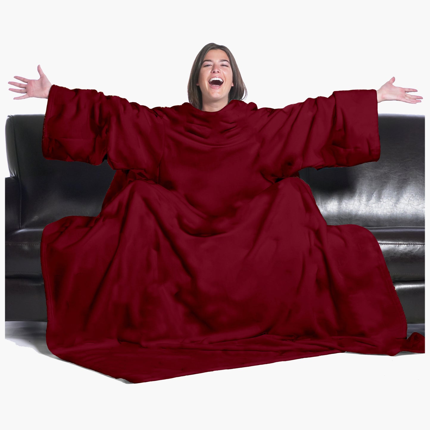The Ultimate Slanket - The Original Blanket with Sleeves. Women using it on a couch with arms spread out with big smile 