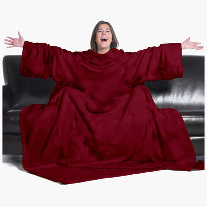 The Ultimate Slanket - The Original Blanket with Sleeves. Women using it on a couch with arms spread out with big smile 
