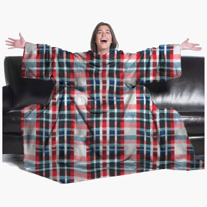 The Ultimate Slanket - The Original Blanket with Sleeves. Women using it on a couch with arms spread out with big smile 